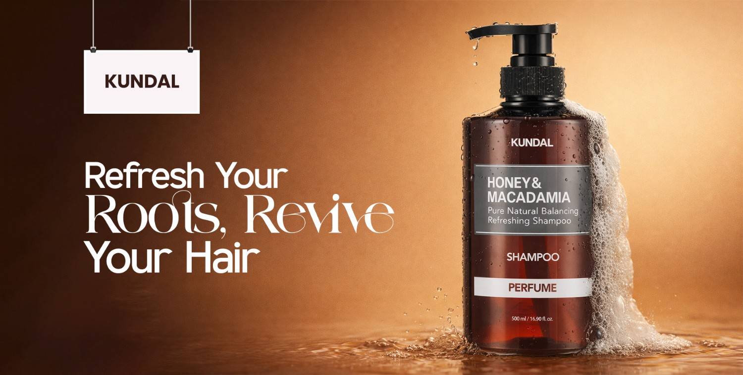 Kundal Honey & Macadamia shampoo bottle with rich foam, promoting refreshed, revived hair.