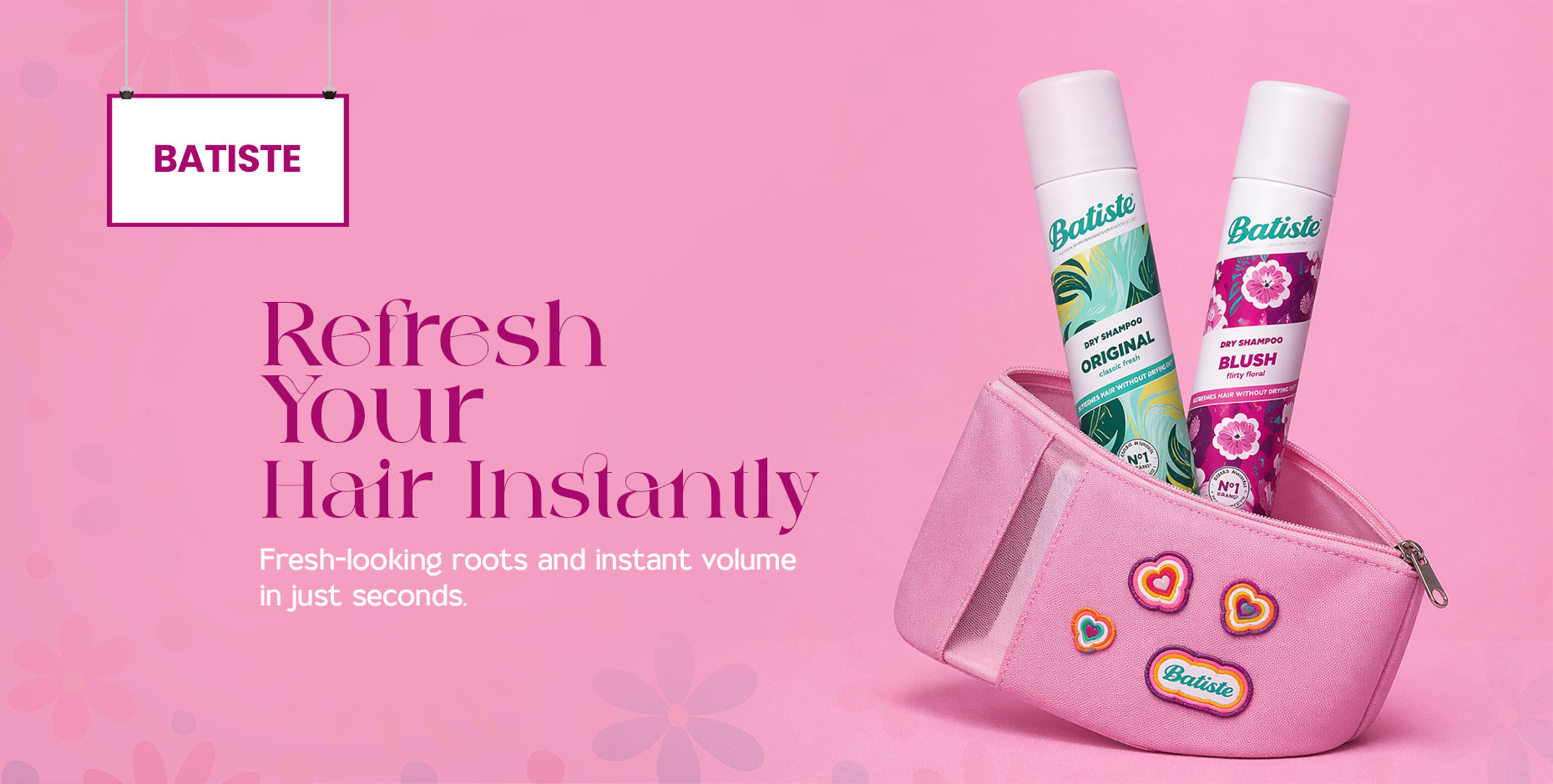 Two Batiste dry shampoos, Original and Blush, in a pink makeup bag on a vibrant pink background.