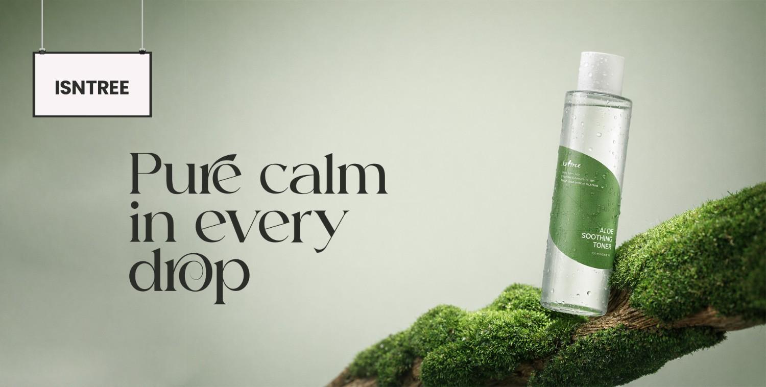 Isntree Aloe Soothing Toner bottle with water droplets, resting on mossy wood, against a serene green background.