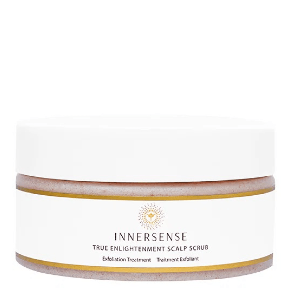 Innersense True Enlightenment Scalp Scrub in a white jar with a gold rim and logo, showing the pink scrub.