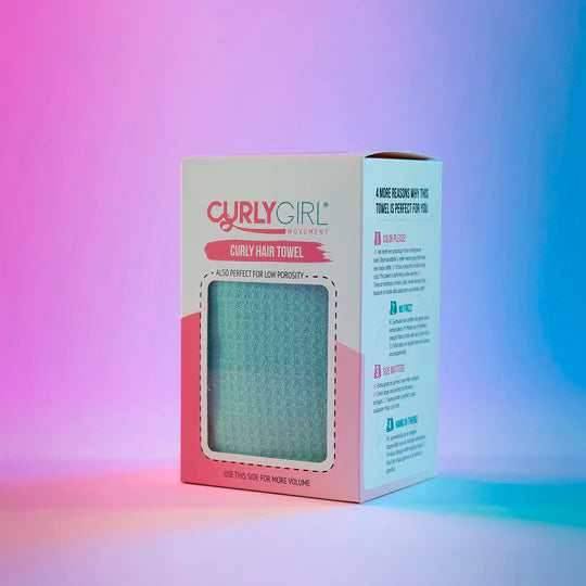 Curly Girl Movement Curly Hair Towel in its white and pink box, showing a peek of the light blue, textured towel.