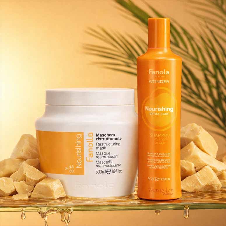 Fanola hair care products including a jar and bottle on a decorative background with stones and leaves.