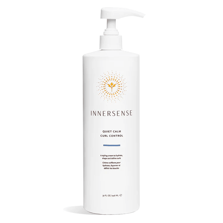 Large white Innersense Quiet Calm Curl Control pump bottle with gold sunburst logo.