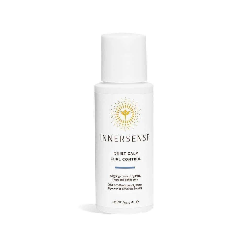 White Innersense Quiet Calm Curl Control bottle with gold sun logo and blue text.