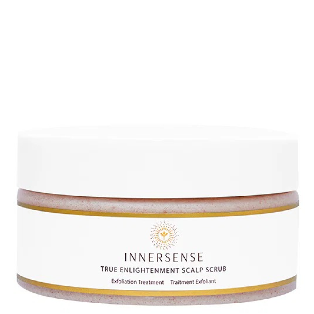 Innersense True Enlightenment Scalp Scrub in a white jar with a gold rim and logo, showing the pink scrub.