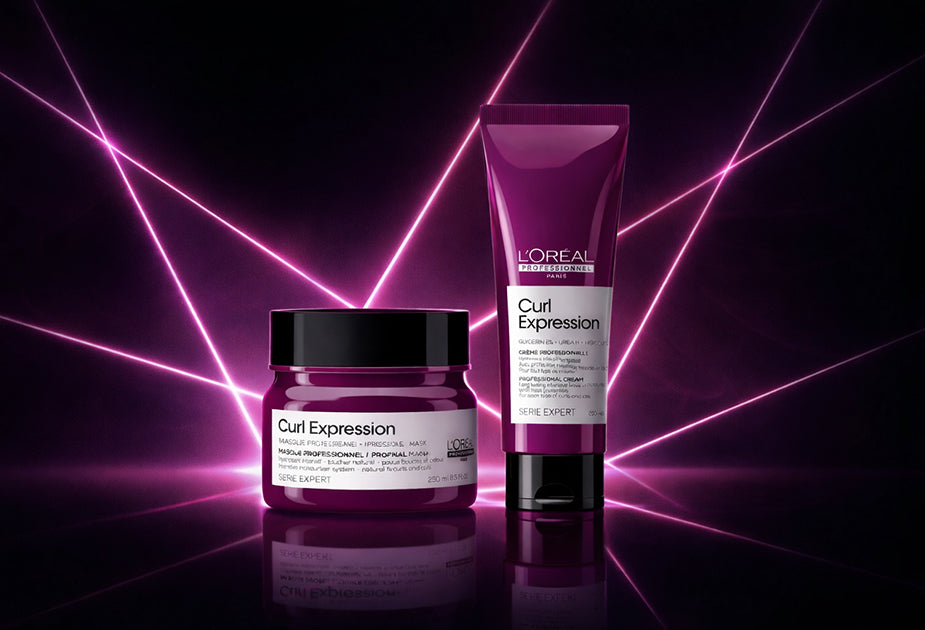 L'Oreal Curl Expression hair care products on a dark background with purple lighting